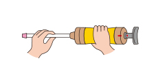 Insert the selected detector tube into the rubber inlet of the pump with the arrow (G) on the tube pointing towards the pump.